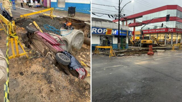 Carro vermelho capotado dentro de uma cratera de obra aberta no meio da rua com tubulações de concreto ao lado